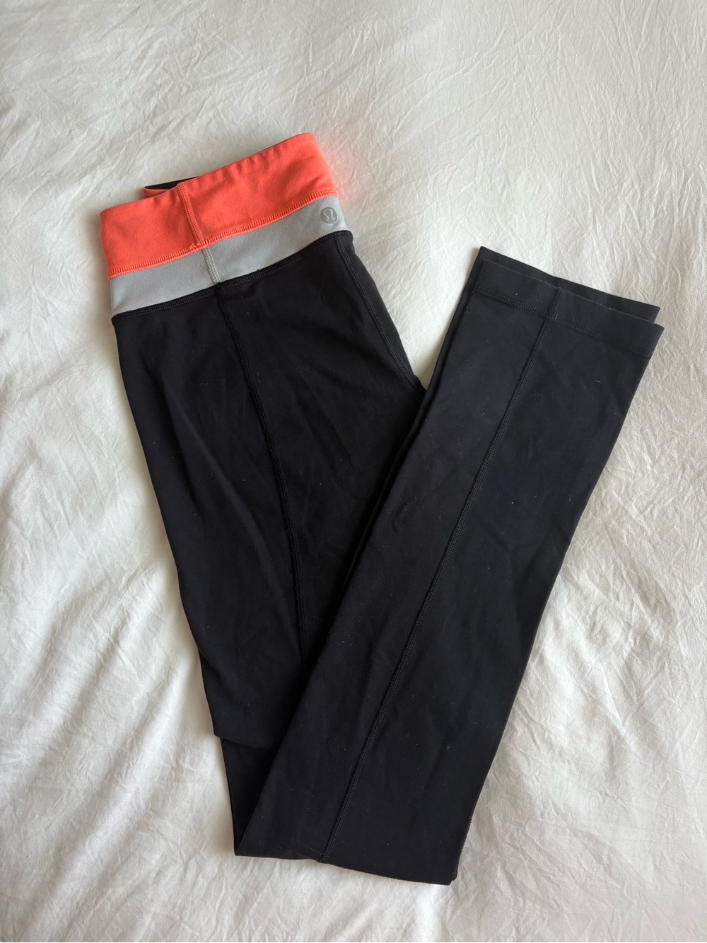 lululemon athletica Black Leggings with Coral Waistband size 6.